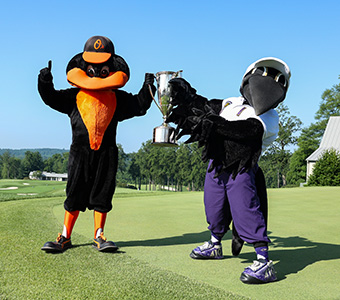 Baltimore sports mascots with trophy